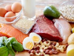 Close-up of different nutrient-rich foods, such as lean meat, fish, dairy, whole grains, and vegetables and fruits