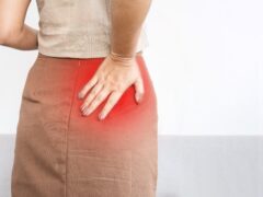 woman suffering from Piriformis Syndrome , feeling pain and numbness in butt, hip or upper leg