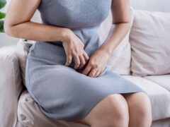 Woman suffering from vaginal itching, burning, and odor due to bacterial vaginosis or yeast infections